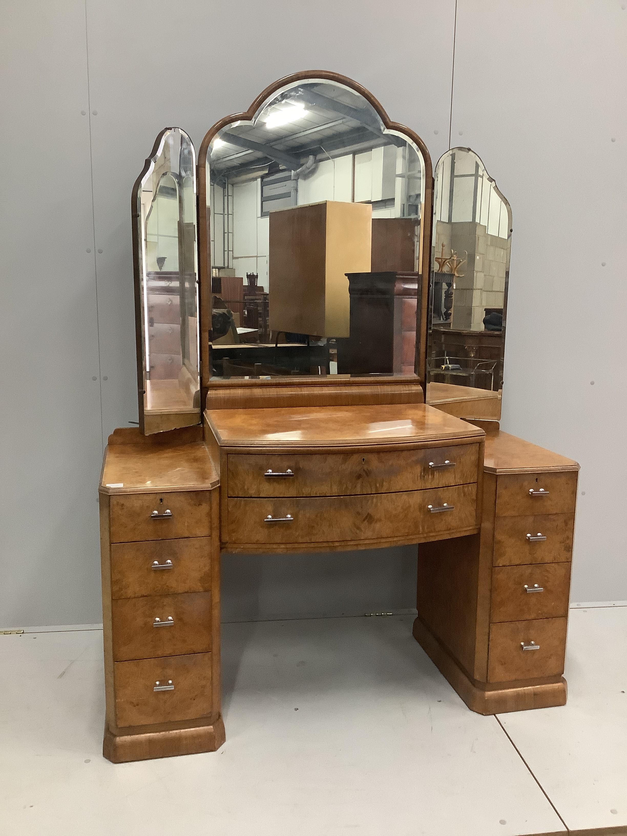An Art Deco style burr walnut kneehole dressing table, width 136cm, depth 53cm, height 188cm together with a stool